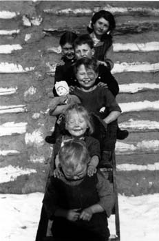 Five eldest Arnesen children on ladder